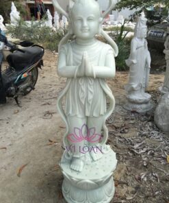 Tượng đá tiểu đồng theo phật